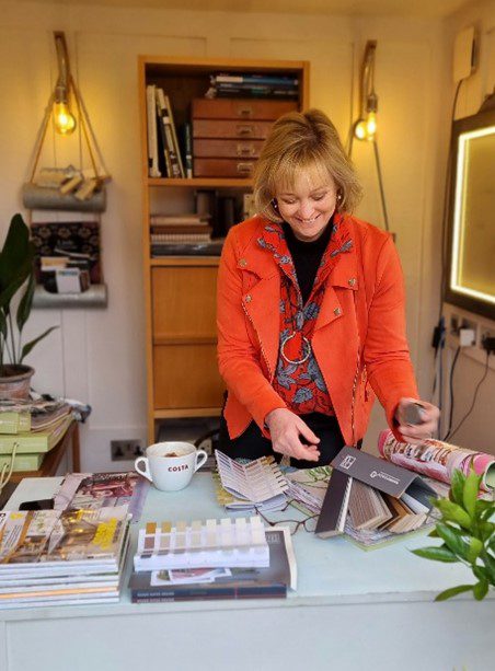 Suz at work with fabric swatches